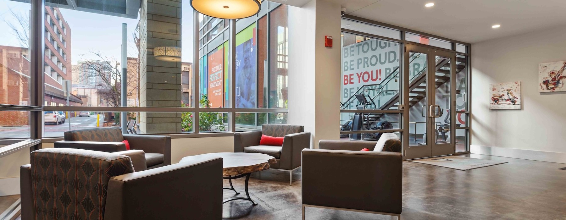 a lounge with chairs and a table