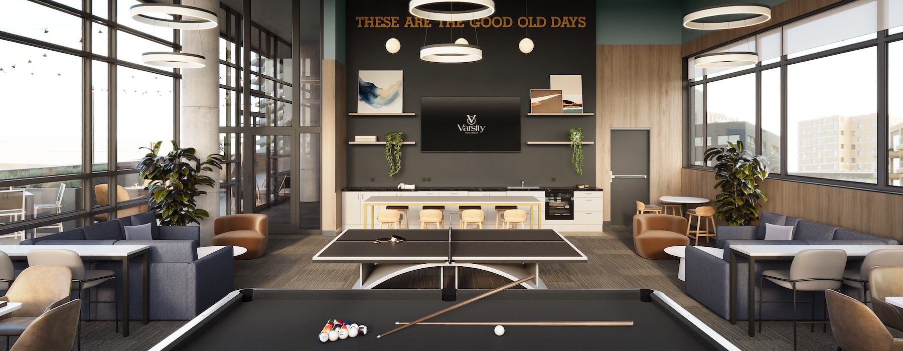 a clubroom with a pool table, tables and chairs