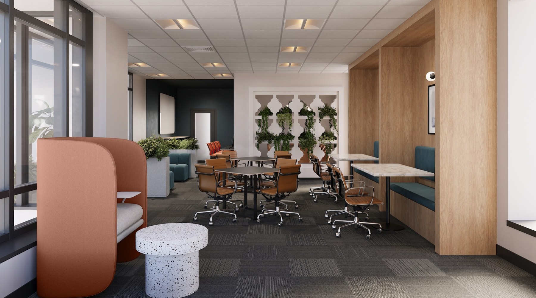 Alt	 a co-working lounge with tables and chairs