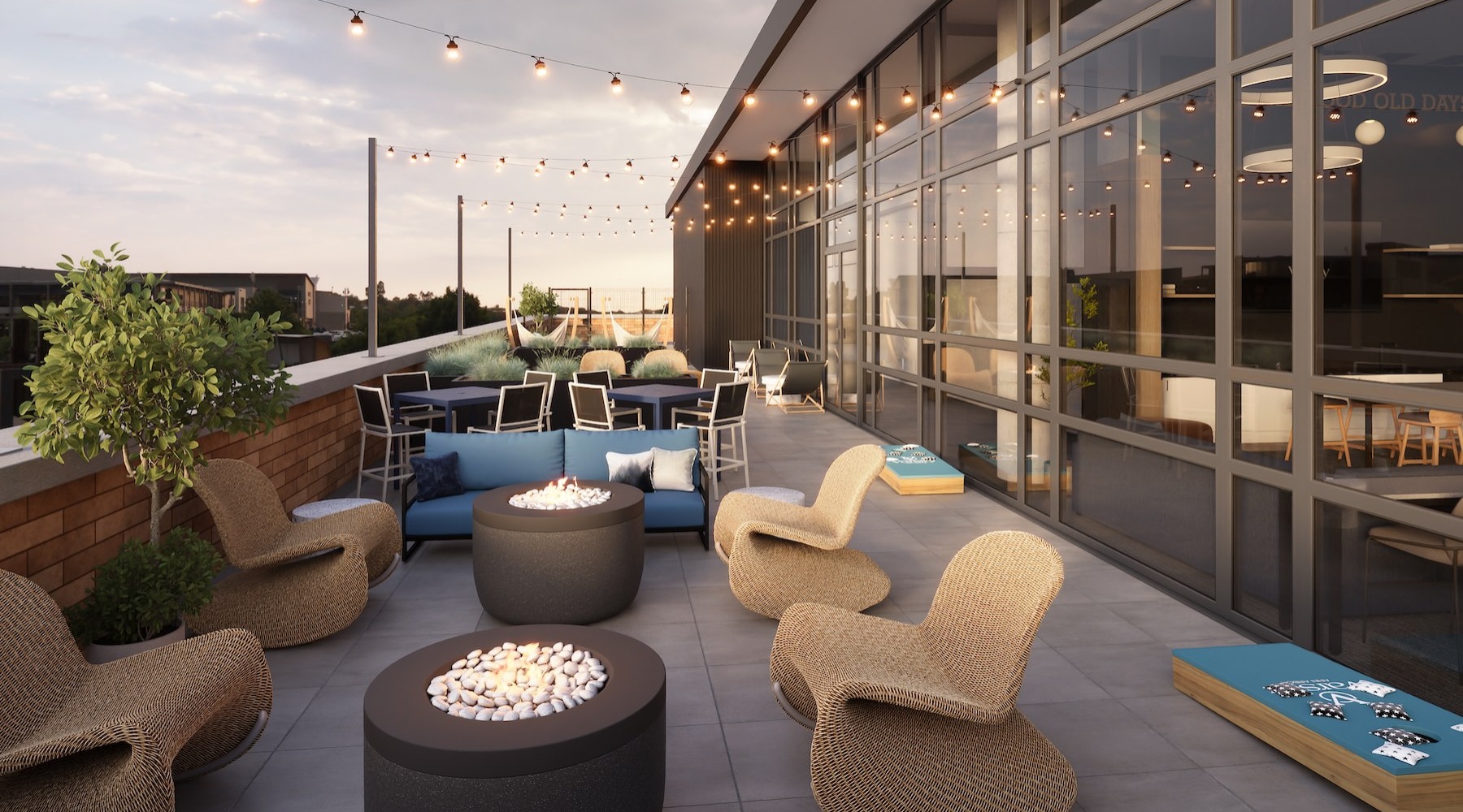 a patio area with tables, chairs and couches