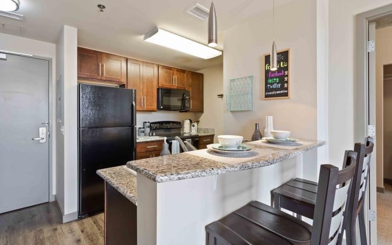 a kitchen with a marble counter top